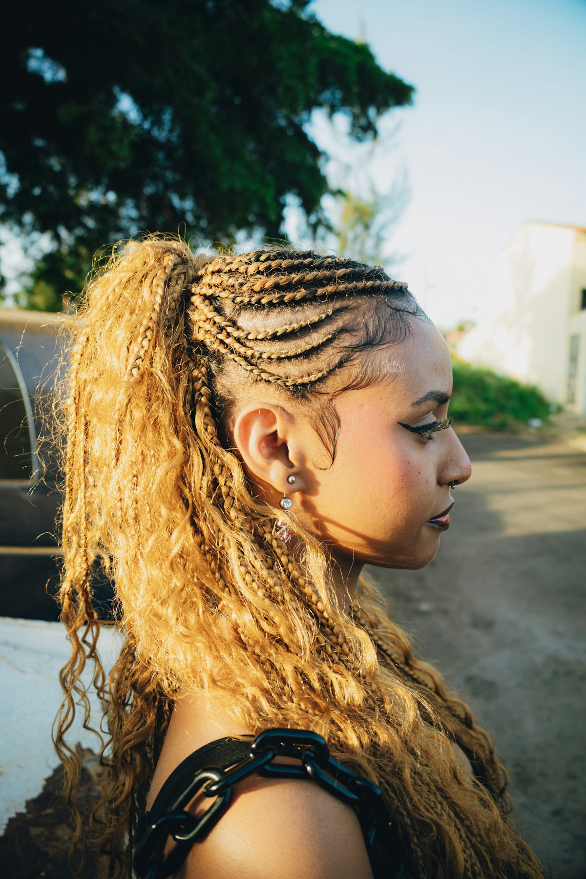 Cornrow ponytail with golden boho waves
